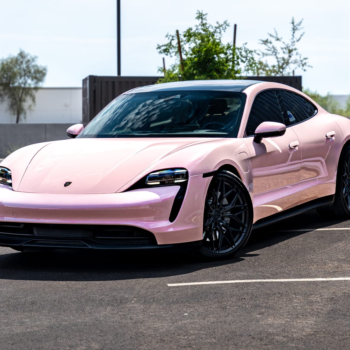 Porsche Taycan in a gloss pink full color change by ZEV Autowerkz