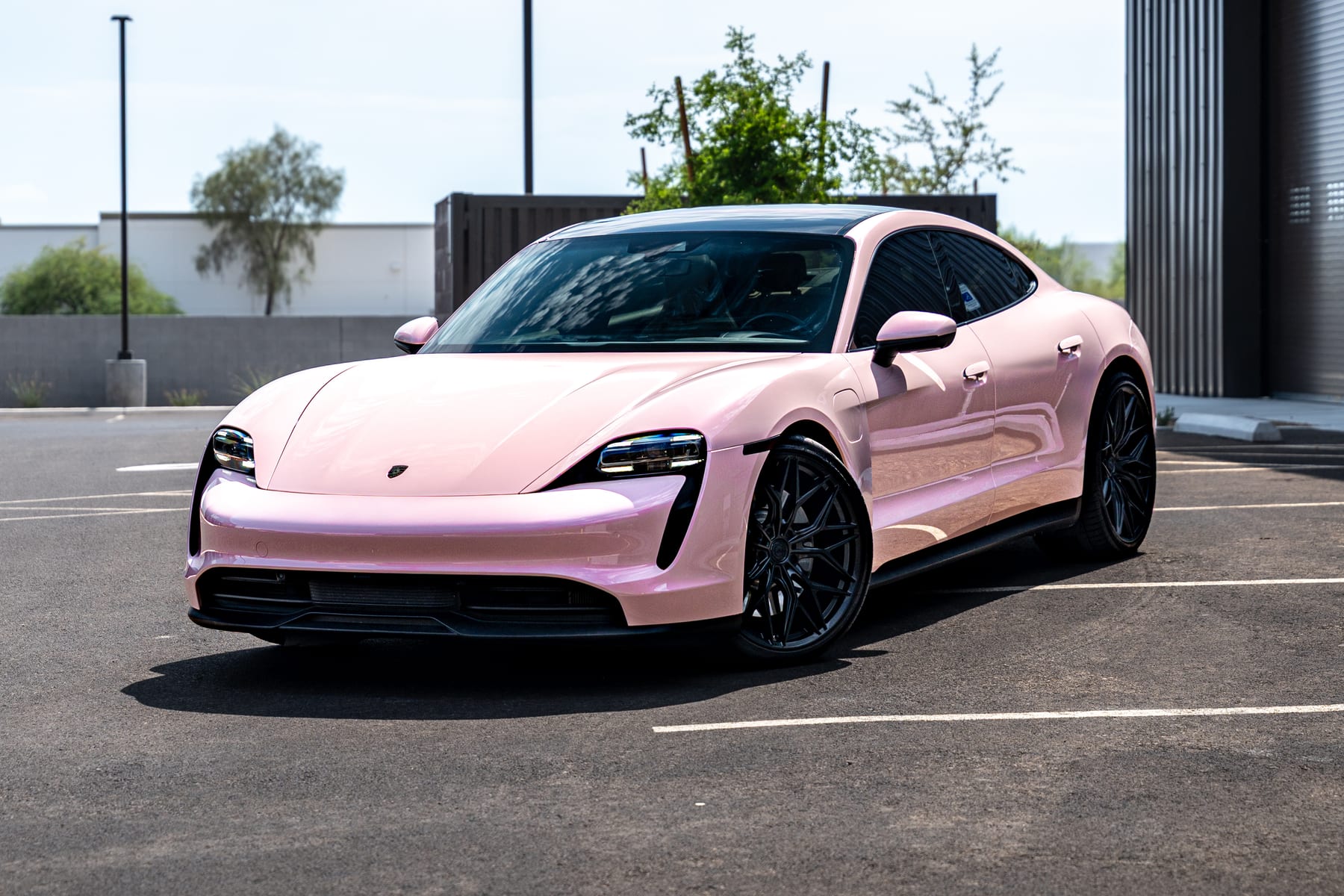 Porsche Taycan in a gloss pink full color change by ZEV Autowerkz